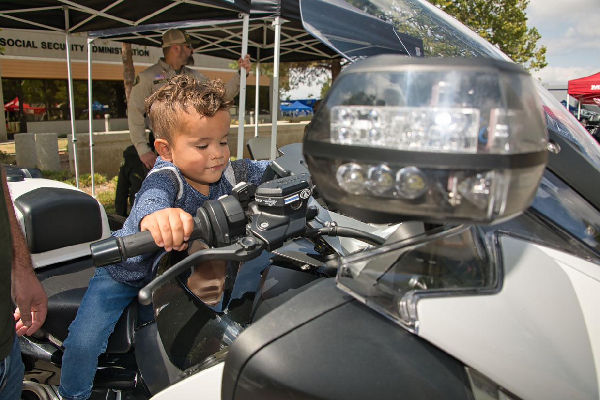 Families exploring public safety equipment at the Expo